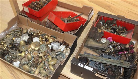 A quantity of brass and iron handles, hinges and hooks etc